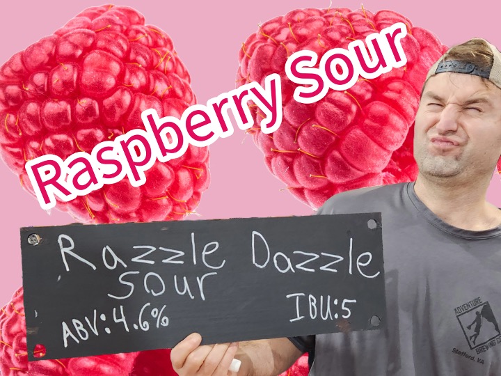 Justin holding the raspberry sour sign